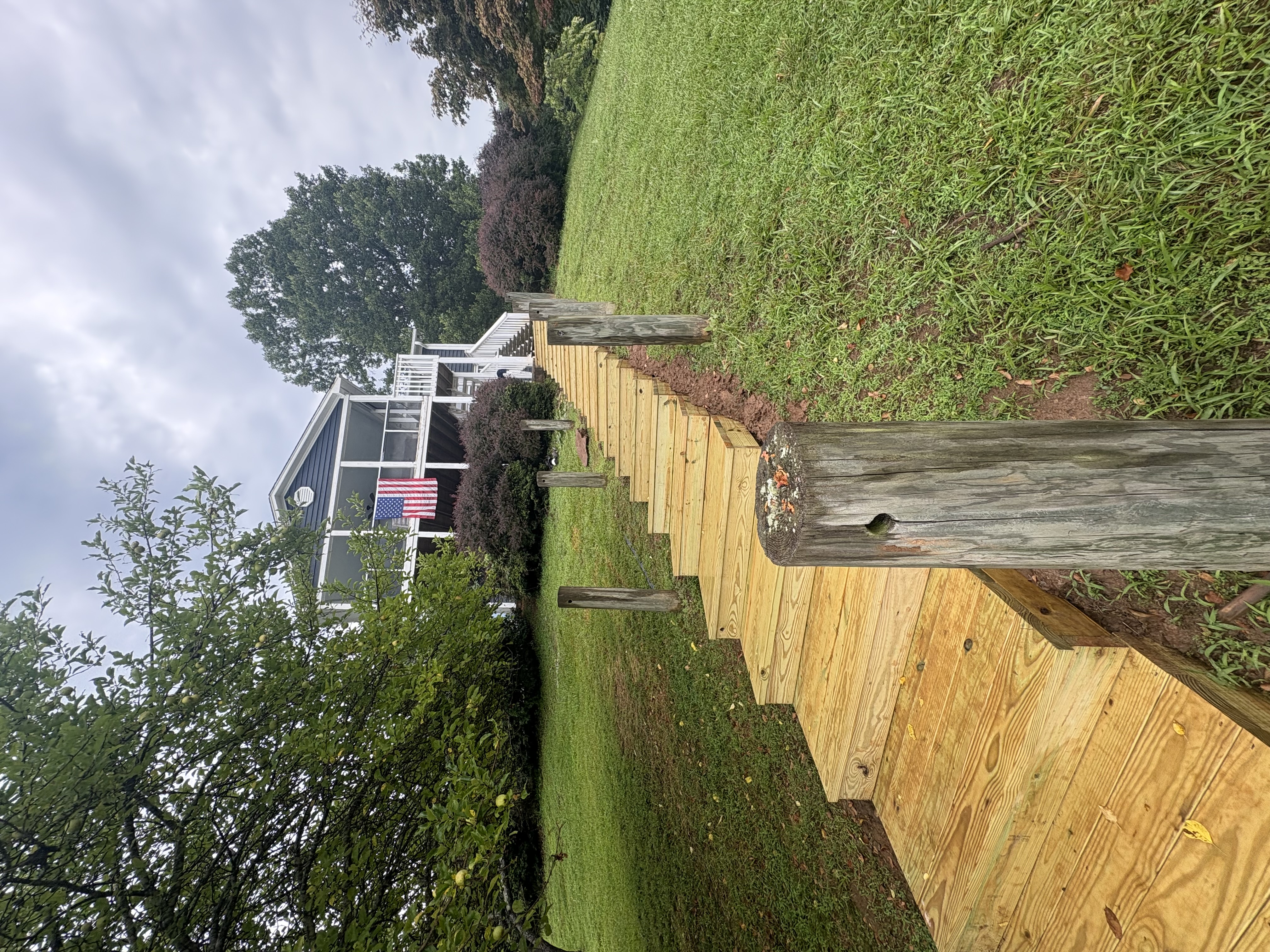 Custom wooden stairs with rope rail on hillside at Smith Mountain Lake