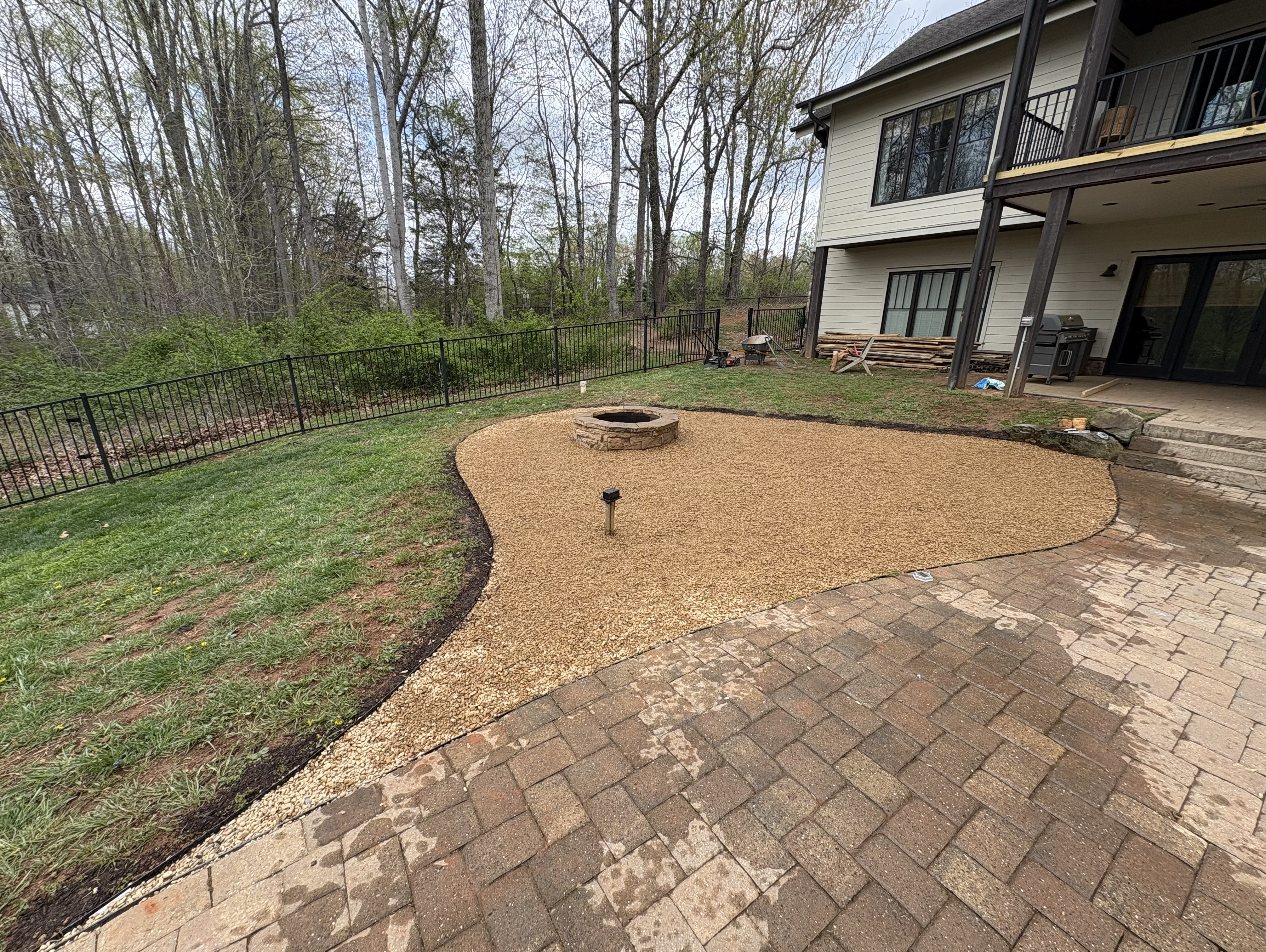 Fire pit installation with gravel surround at Smith Mountain Lake