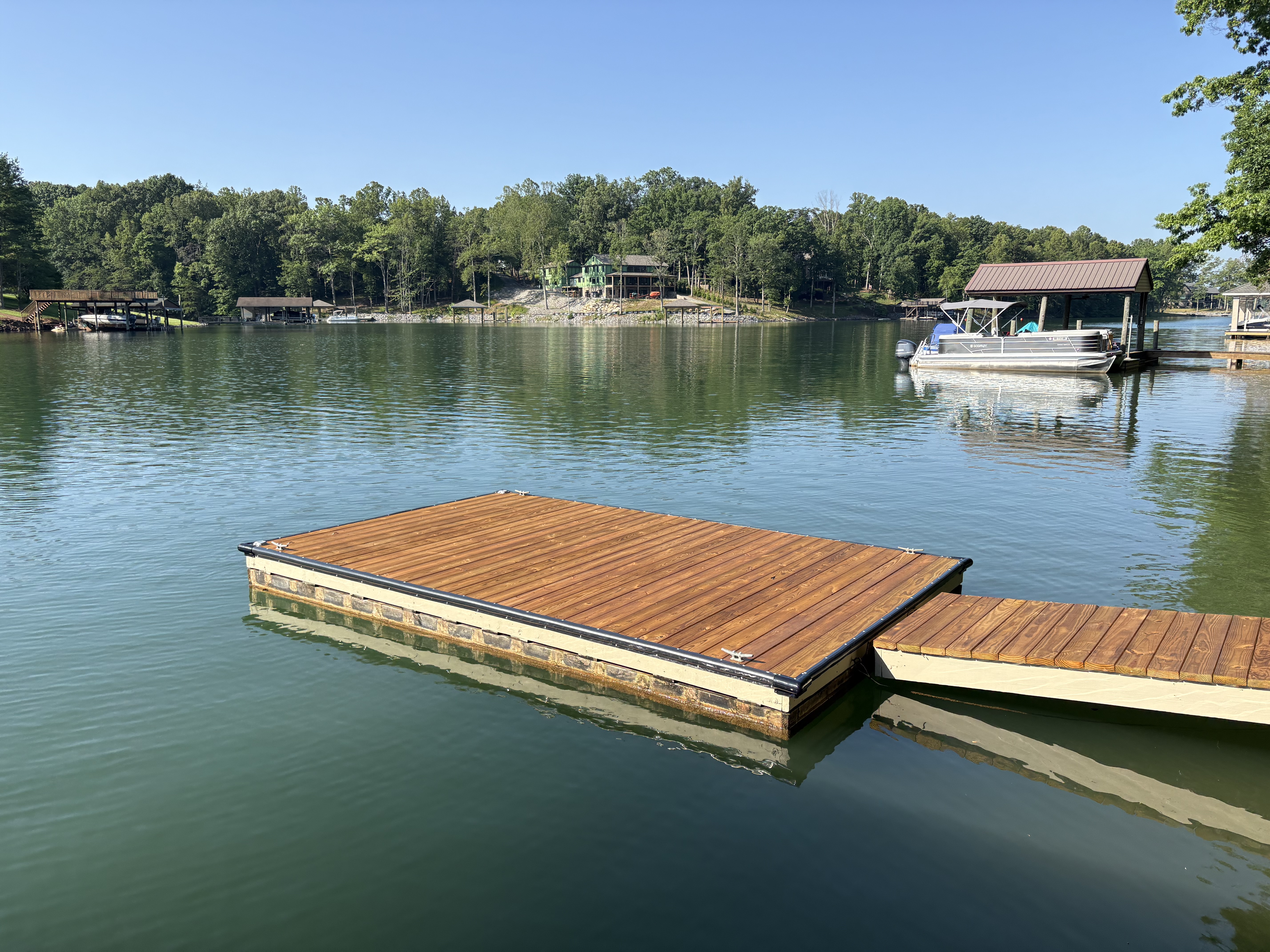 Floating dock with natural wood stain at Smith Mountain Lake